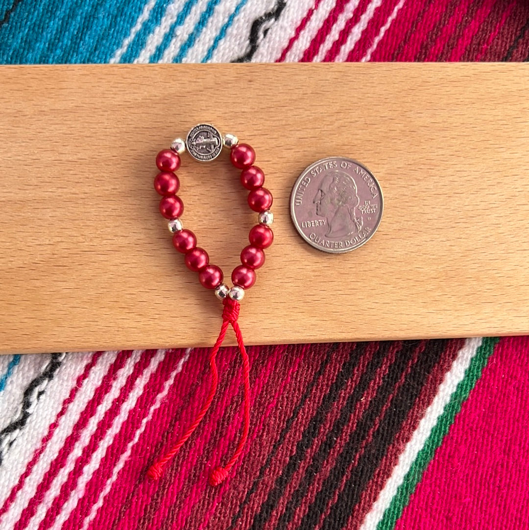Pulsera de bebé con perlas rojas
